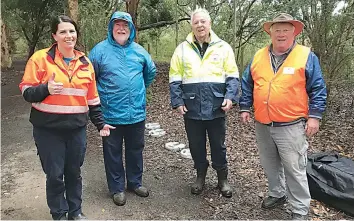  ?? ?? Baw Baw Shire’s Michelle Kerin with Friends of Drouin’s Trees members Chris Healy, Peter Ware and Henry Corcoran at the Golden Whistler Reserve.