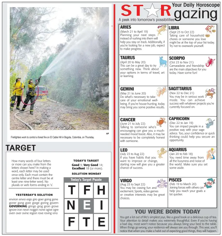  ?? ?? Firefighte­rs work to control a forest fire on El Cable Hill in Bogota, Colombia, on Thursday. 9;
SOLUTION MONDAY
AP