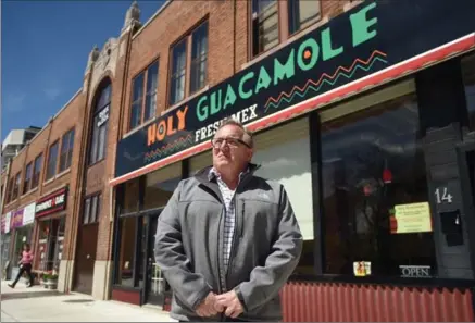  ?? DAVID BEBEE, RECORD STAFF ?? Mike Snider, co-owner of Holy Guacamole, outside the original location on Duke Street in downtown Kitchener.