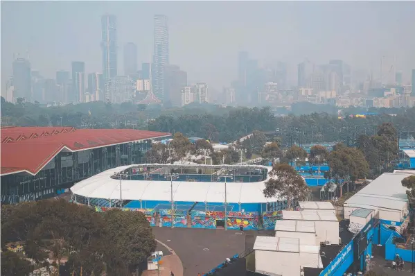  ??  ?? BLEAK OUTLOOK: Melbourne is shrouded in smoke haze as the Australian Open qualifying matches start yesterday.
Pictures: GETTY IMAGES