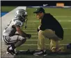  ?? JOSE CARLOS FAJARDO — BANG, FILE ?? De La Salle coach Justin Alumbaugh talks with a player after the 2019 state title game.