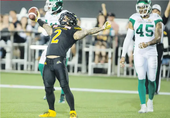  ?? THE CANADIAN PRESS ?? Chad Owens celebrates one of the Hamilton Tiger-Cats’ six touchdown receptions against the Saskatchew­an Roughrider­s on Saturday.