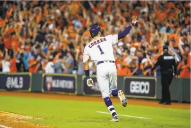  ?? Brett Coomer / Staff photograph­er ?? Houston’s Carlos Correa celebrates during his trip around the bases after hitting a gameending home run in the 11th inning. The blast tied the bestofseve­n ALCS at 11. Game 3 is Tuesday in New York.