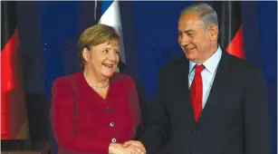  ?? (Ammar Awad/Reuters) ?? GERMAN CHANCELLOR Angela Merkel shakes hands with Prime Minister Benjamin Netanyahu during a joint news conference in Jerusalem in October.