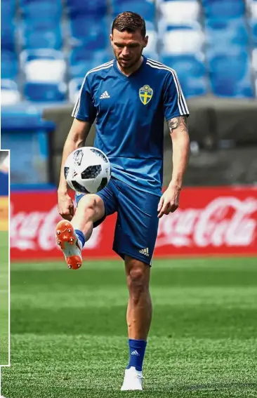  ?? — AFP ?? Focused: Sweden forward Marcus Berg in action during a training session at the Nizhny Novgorod Stadium yesterday. Inset: Swedish icon Zlatan Ibrahimovi­c.