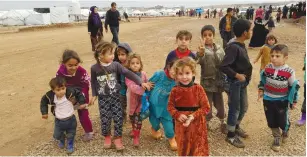  ?? (Molly Hennessy-Fiske/Los Angeles Times/TNS) ?? CHILDREN PLAY at the Hassan Sham camp, home to about 21,000 displaced families who fled the Mosul area.