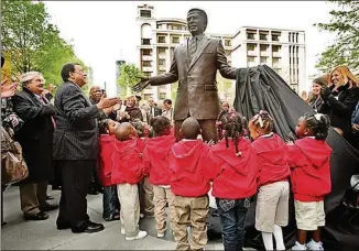  ?? JOHN SPINK/AJC FILE ?? The 8.5-foot bronze statue of Andrew Young was created by North Carolina sculptor Johnpaul Harris at Walton Spring Park.