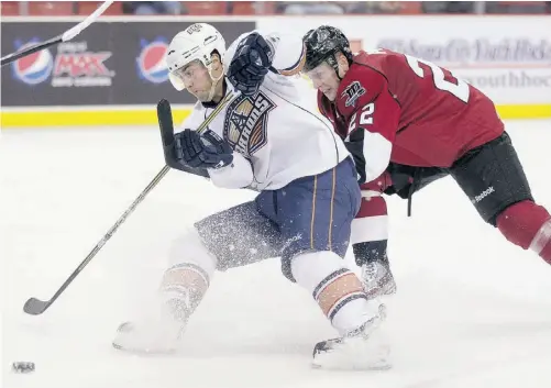  ?? STEVEN CHRISTY/ OKC BARONS ?? Oklahoma City Barons forward Jordan Eberle skates past Thomas Pock of the Lake Erie Monsters during American Hockey League action at the Cox Convention Center in Oklahoma City on Tuesday night. The Barons won 4-3.