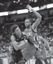  ?? GERALD HERBERT AP ?? Heat guard Josh Richardson drives past Pelicans forward Darius Miller. Richardson had a team-high 22 points.