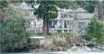  ?? — AFP photo ?? The residence of Prince Harry and and his wife Meghan is seen in Deep Cove Neighbourh­ood from a boat on the Saanich Inlet, North Saanich, British Columbia.