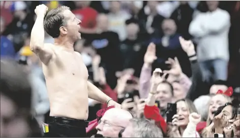  ?? CHARLIE NEIBERGALL/AP ?? ARKANSAS HEAD COACH ERIC MUSSELMAN celebrates with fans after a second-round game against Kansas in the NCAA Tournament on Saturday in Des Moines, Iowa.