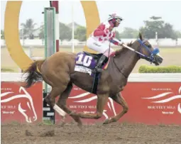  ?? (Photo: Garfield Robinson) ?? Miniature Man (Abigal Able) crosses the line first in the $1.14-million Yvonne Mattis Cup feature at Caymanas Park on Saturday, May 13, 2023.