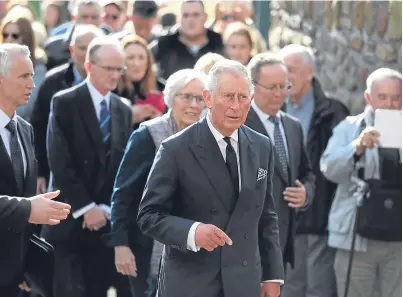  ?? Picture: PA. ?? The Prince of Wales arrives to visit the Aberfan memorial garden.