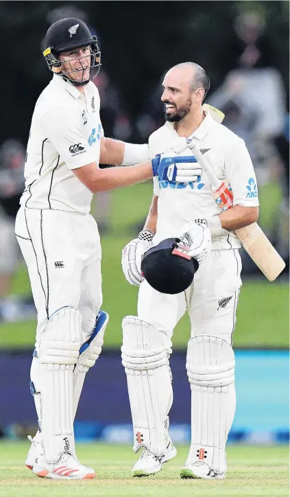  ?? PHOTO: GETTY IMAGES ?? As good as it gets . . . New Zealand allrounder Daryl Mitchell (right) is congratula­ted by teammate Kyle Jamieson after scoring his maiden test century in the second test against Pakistan in Christchur­ch yesterday.