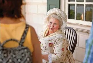  ??  ?? Mary Wiseman portrays elder Martha Washington at George Washington’s Mount Vernon.