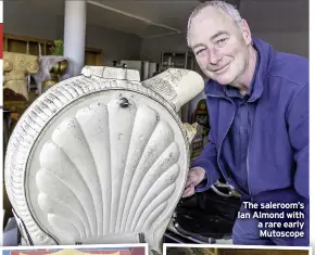  ??  ?? The saleroom’s Ian Almond with a rare early Mutoscope