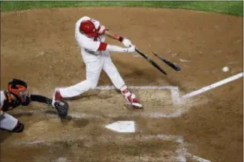  ?? MATT SLOCUM — THE ASSOCIATED PRESS ?? The Phillies’ Aaron Altherr breaks his bat on a single off Giants relief pitcher Pierce Johnson during the sixth inning Wednesday. At left is catcher Buster Posey. The Phillies won 11-3.