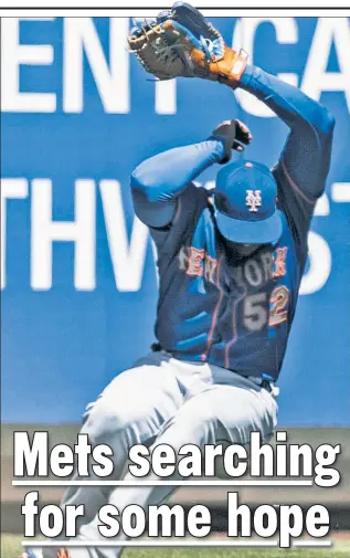  ?? Getty Images ?? SUN OF A ... Yoenis Cespedes is unable to track a fly ball hit by Ben Gamel after losing the ball in the sun during the second inning of the Mets’ 9-1 loss.