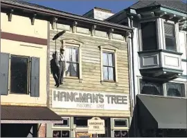  ?? Hailey Branson-Potts Los Angeles Times ?? IN A THROWBACK to the town’s Wild West history of extralegal justice — mob rule, as some see it — a dummy dangles from a noose on Main Street in Placervill­e.