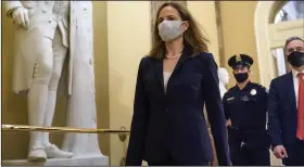  ?? (AP/J. Scott Applewhite) ?? Judge Amy Coney Barrett, President Donald Trump’s nominee for the Supreme Court, arrives at the Capitol on Wednesday for meetings with several senators.