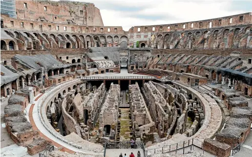  ?? AP ?? Visitors arrive for their tour of the ancient Colosseum, in Rome. Italy’s culture minister, Dario Franceschi­ni, has announced a project to build and install a retractabl­e floor inside the Colosseum.