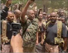  ?? SUDANESE ARMY VIA AP ?? In this photo released by the Sudanese Army on Tuesday, Gen. Abdel-fattah Burhan visits the troops in Khartoum, Sudan.