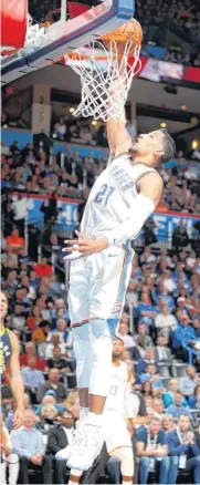  ?? [PHOTO BY BRYAN TERRY, THE OKLAHOMAN] ?? Oklahoma City’s Andre Roberson dunks the ball during Wednesday’s game between the Oklahoma City Thunder and the Indiana Pacers at Chesapeake Energy Arena.