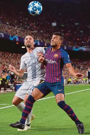  ?? AFP PIC ?? Barcelona’s Rafinha (right) and Inter Milan’s Borja Valero in action in a Champions League Group B match at Nou Camp on Wednesday.