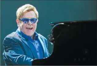  ?? PHOTO BY PAUL A. HEBERT — INVISION — AP ?? Elton John performs on stage at Staples Center on Saturday in Los Angeles.