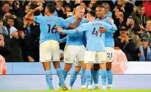  ?? ?? Manchester City players celebrate a goal during an English Premier League match recently.