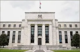  ?? Patrick Semansky / Associated Press ?? Among other moves, the Federal Reserve is expected to announce that it will begin shrinking its vast stockpile of Treasury and mortgage bonds — a move that will have the effect of further tightening credit.