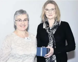  ??  ?? ●●Clare Ratchford receiving her award from Susan Rae