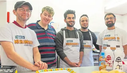  ?? Picture: Kim Cessford. ?? From left: volunteers Kevin Marnie and Stevie Lee with project managers Umer Farooq, Faisal Hussein and Rizwan Rafik at a support cafe in Kirkton Community Centre run by YYI.
