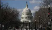  ?? REBECCA BLACKWELL — THE ASSOCIATED PRESS ?? National Guard troops walk outside the Capitol as the security perimeter continues to shrink and many Guard units head home, two days after the inaugurati­on of President Joe Biden on Friday, in Washington.