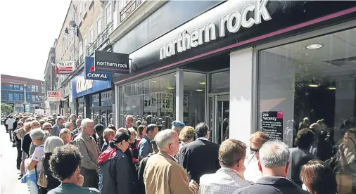  ??  ?? COLLAPSE: Customers of Northern Rock queue outside a London branch of the company to take their money out of their accounts in 2007