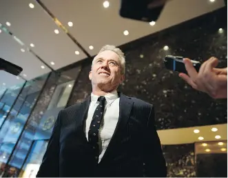  ?? EVAN VUCCI/ THE ASSOCIATED PRESS ?? Anti-vaccine alarmist Robert F. Kennedy Jr. speaks with reporters in the lobby of Trump Tower in New York earlier this week after meeting with President-elect Donald Trump.