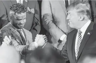  ?? Andrew Harnik / Associated Press ?? President Donald Trump greets the “amazing” Jose Altuve, the American League MVP who helped the Astros win their first World Series, during the team’s visit to the White House.