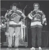  ?? LIAM RICHARDS / THE CANADIAN PRESS ?? Comedians Terry Ree, left, and Bruce Williams, known as The Indian and the White Guy, perform Friday at the Humboldt Broncos Tribute Concert in Saskatoon.