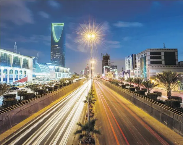  ?? WASEEM OBAIDI / BLOOMBERG ?? The Kingdom Tower, left, stands alongside the King Fahd highway in Riyadh, Saudi Arabia, which has been in a diplomatic spat with Canada.