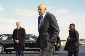  ?? PATRICK SEMANSKY / AP ?? U.S. Sen. John Fetterman, D-pennsylvan­ia, walks to a motorcade vehicle after stepping off Air Force One behind President Joe Biden earlier this month at Philadelph­ia Internatio­nal Airport in Philadelph­ia.