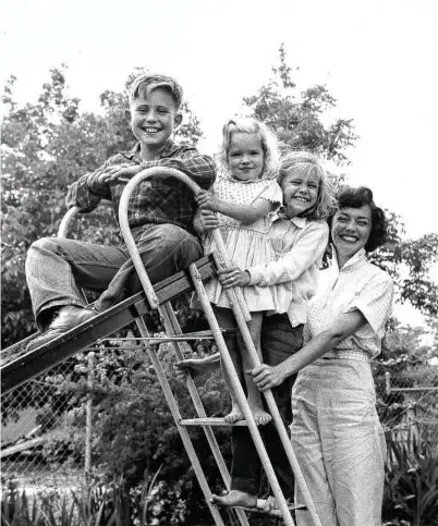  ?? Sally Field / New York Times ?? A young Sally Field, third from left, poses for a portrait with her family. Though her memoir delves into some of her famous acting roles and relationsh­ips, it is no taditional showbiz autobiogra­phy.