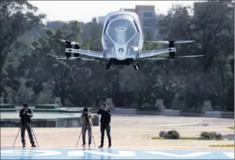  ?? WU WEIHONG / FOR CHINA DAILY ?? An Ehang 184 autonomous aerial vehicle performs a test flight in Guangzhou, Guangdong province.