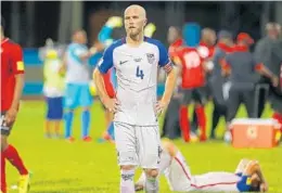  ?? ASHLEY ALLEN/GETTY IMAGES ?? Captain Michael Bradley of the United States mens national team reacts as Trinidad and Tobago pulls off the stunning win during the FIFA World Cup Qualifier match.