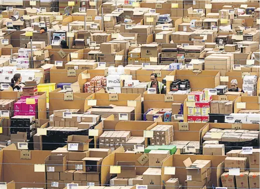  ?? Picture / Bloomberg ?? Amazon slashed its taxable profits in Europe from centres like this one in Britain by channellin­g them to a taxfree unit in Luxembourg.