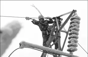  ?? QIN GANG / FOR CHINA DAILY ?? A technician of China Southern Power Grid does maintenanc­e work in Leishan county, Guizhou province. The company will invest in upgrading the rural electric power grid.