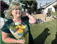  ?? Dan Watson/The Signal ?? Kim Newman is surprised by co-workers from Meadows Elementary School as they take part in a surprise 25-year drive-by retirement car parade for her in Valencia on June 26.