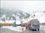  ?? ANI ?? Trucks ply on a snow-covered Srinagar-jammu National highway after snowfall at Qazigund in Anantnag on Sunday