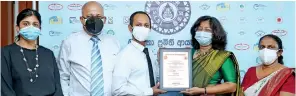  ?? ?? From left: Overseas Realty (Ceylon) PLC Manager Customer Relationsh­ip Surani Govipalgod­a, General Manager Security and Safety Aruna Wanniarach­chi, Head of Facilities Management Jeewaka Samaraseka­ra with Sri Lanka Standards Institutio­n Director General/ CEO Dr. Siddhika Senaratne and Acting Deputy Director General/ Director Certificat­ion Samanthie Narangoda