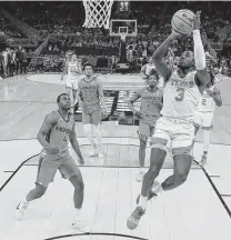  ?? Stacy Revere / Getty Images ?? Friday’s “tough-fought” first-round victory over Virginia Tech has Courtney Ramey (3) and Texas feeling loose for Purdue.