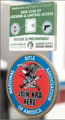  ??  ?? An informatio­nal sticker about suicide prevention at a Spokane, Washington, gun shop.